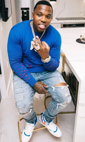 BandMan Kevo wearing Louis Vuitton sweater