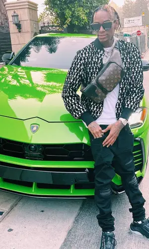 Soulja Boy wearing Louis Vuitton bag