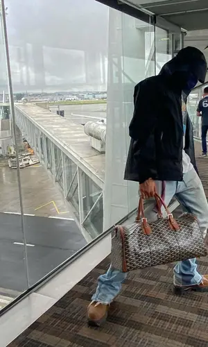 24kGoldn’s Outfit in Arc'teryx Jacket, Gallery Dept. Jeans & Goyard Bag (2021)