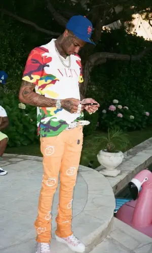 Blueface wearing Valentino t-shirt