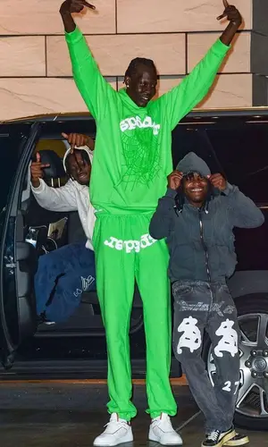 Bol Bol wearing Spider Worldwide pants