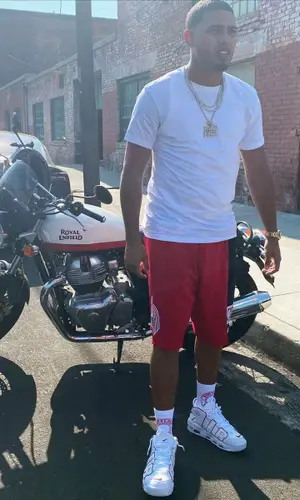 Myke Towers wearing Burberry sock