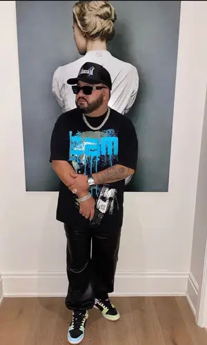 Cash wearing Nike sneakers