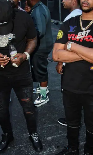 EST Gee wearing Supreme cap