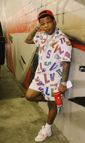 Rylo Rodriguez wearing Louis Vuitton shirt
