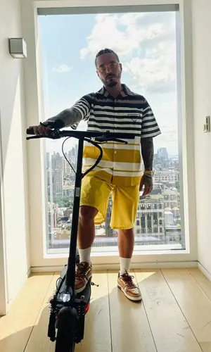 J Balvin wearing Prada shirt
