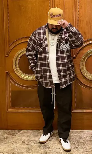 Cash wearing Nike sneakers