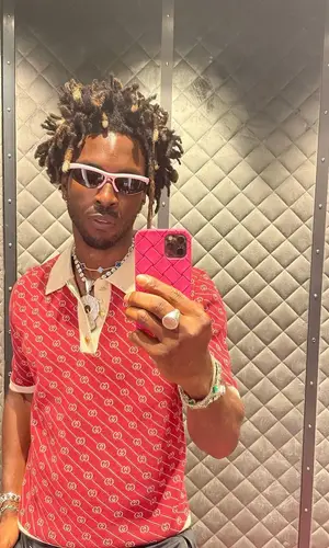 Saint JHN wearing Bottega Veneta eyewear