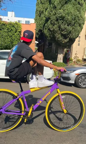Taco wearing New Era cap