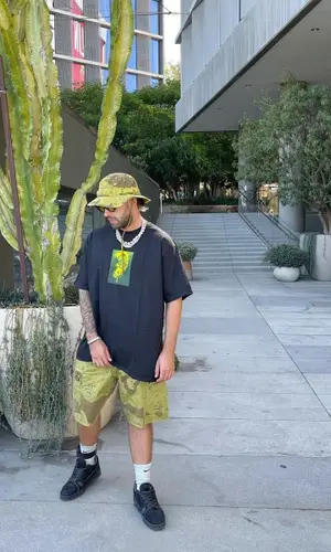 Feid wearing Supreme t-shirt