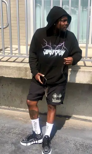 Wale wearing Rhude shorts