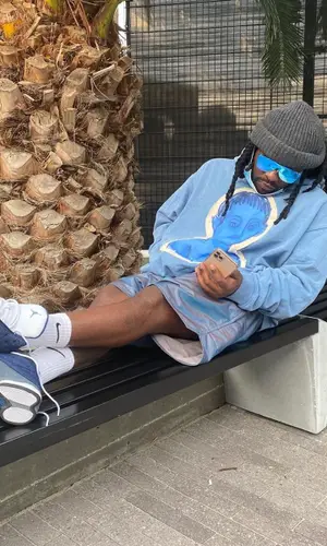 Wale wearing Fear of God shorts