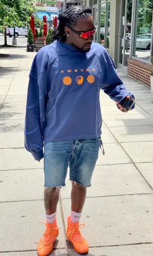Wale wearing Ambush sweatshirt