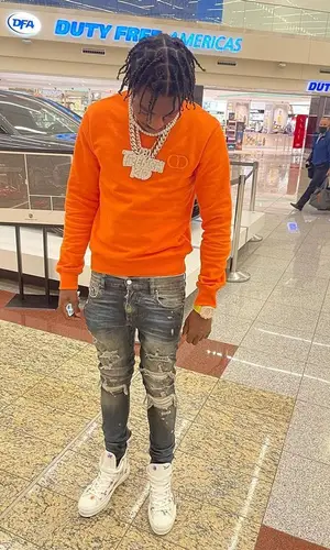 Lil Tjay wearing Dior sweatshirt
