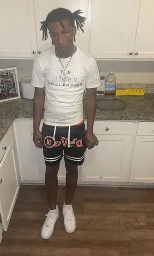 Lil Kee wearing Novera Collection shorts
