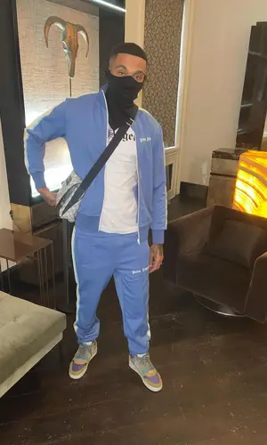 Fredo wearing Palm Angels t-shirt