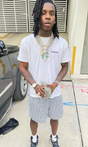 Polo G wearing Louis Vuitton bag