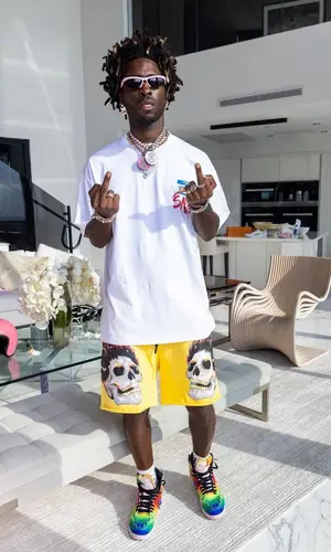 Saint JHN wearing Bottega Veneta eyewear
