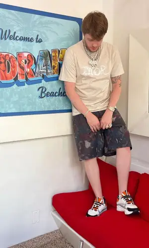 Murda Beatz wearing Dior shorts