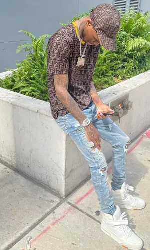 Lil Reese wearing Fendi t-shirt