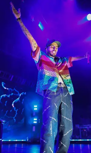 Rauw Alejandro wearing Gucci shirt