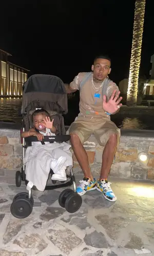 Fredo wearing Palm Angels t-shirt
