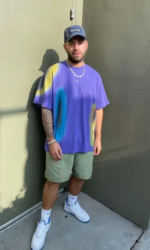 Feid wearing A-Cold-Wall* t-shirt
