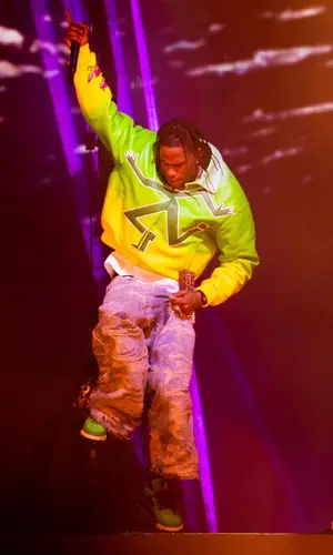 Travis Scott wearing Takashi Murakami belt