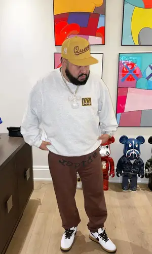 Cash wearing Travis Scott Merch sweatshirt