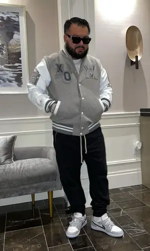 Cash wearing Nike sneakers