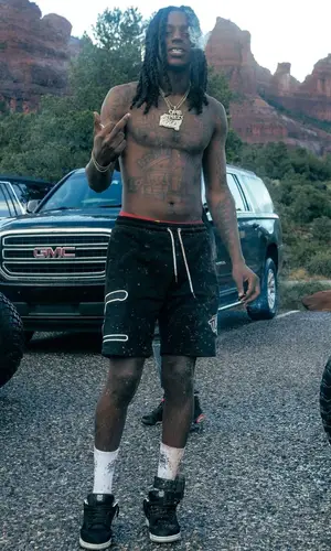 OMB Peezy wearing Tulones shorts