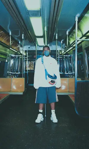 Feid wearing Supreme jacket