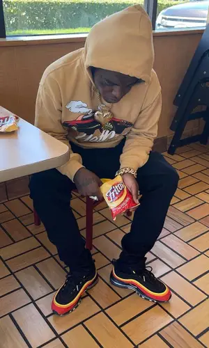 Kodak Black wearing Sniper Gang Apparel hoody