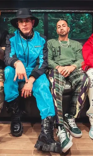 Lenny Tavarez wearing Prada boots