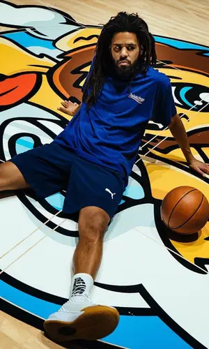 J. Cole wearing Dreamville sock
