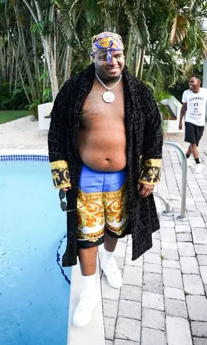 Duke Deuce wearing Versace scarf