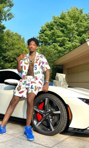 21 Savage wearing NBA shorts