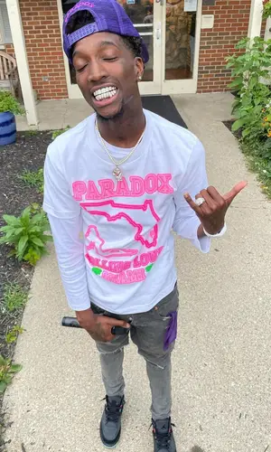 YTB Trench wearing Paradox t-shirt