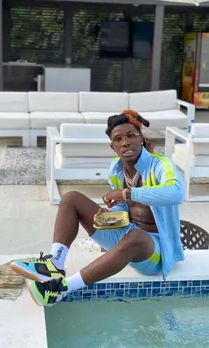 Hot Boii wearing Nike sneakers