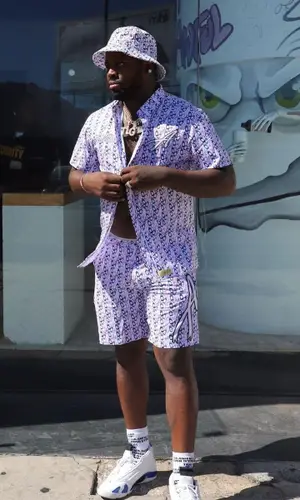 Desto Dubb wearing Awful Lot of Cough Syrup sock