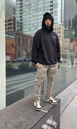 Nicky Jam’s Outfit in Vetements Hoodie, Nike Sneakers & Travis Scott Merch (2021)