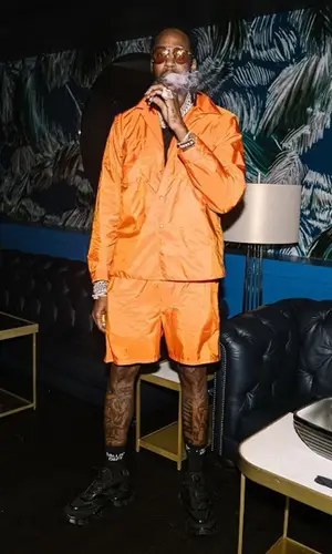 2 Chainz wearing Prada shirt