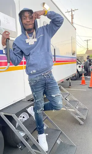 Lil Tjay’s Outfit in Chrome Hearts Hoodie, Amiri Jeans & Drake Merch (2021)