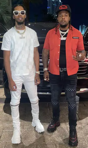 Rowdy Rebel wearing Goyard belt