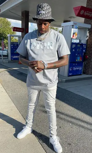 Lil Duke wearing Dior hat