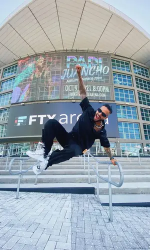 Maluma wearing Louis Vuitton pants