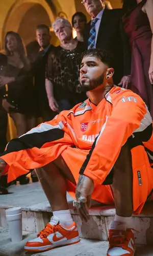 Anuel AA wearing Balenciaga t-shirt