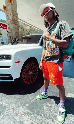 Rich The Kid wearing Cough Syrup shorts