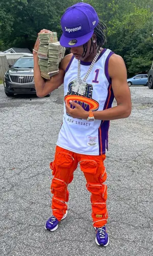 Lil Baby wearing Space Jam jersey