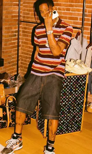 Travis Scott wearing Louis Vuitton bag